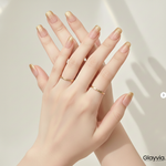 Both hands showing elegant gold glitter gradient nails with glossy nude base manicure