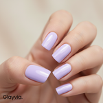 Close-up of hand wearing Glayvia lavender semi-cured gel nail wraps with smooth glossy pastel purple manicure (NG200009)