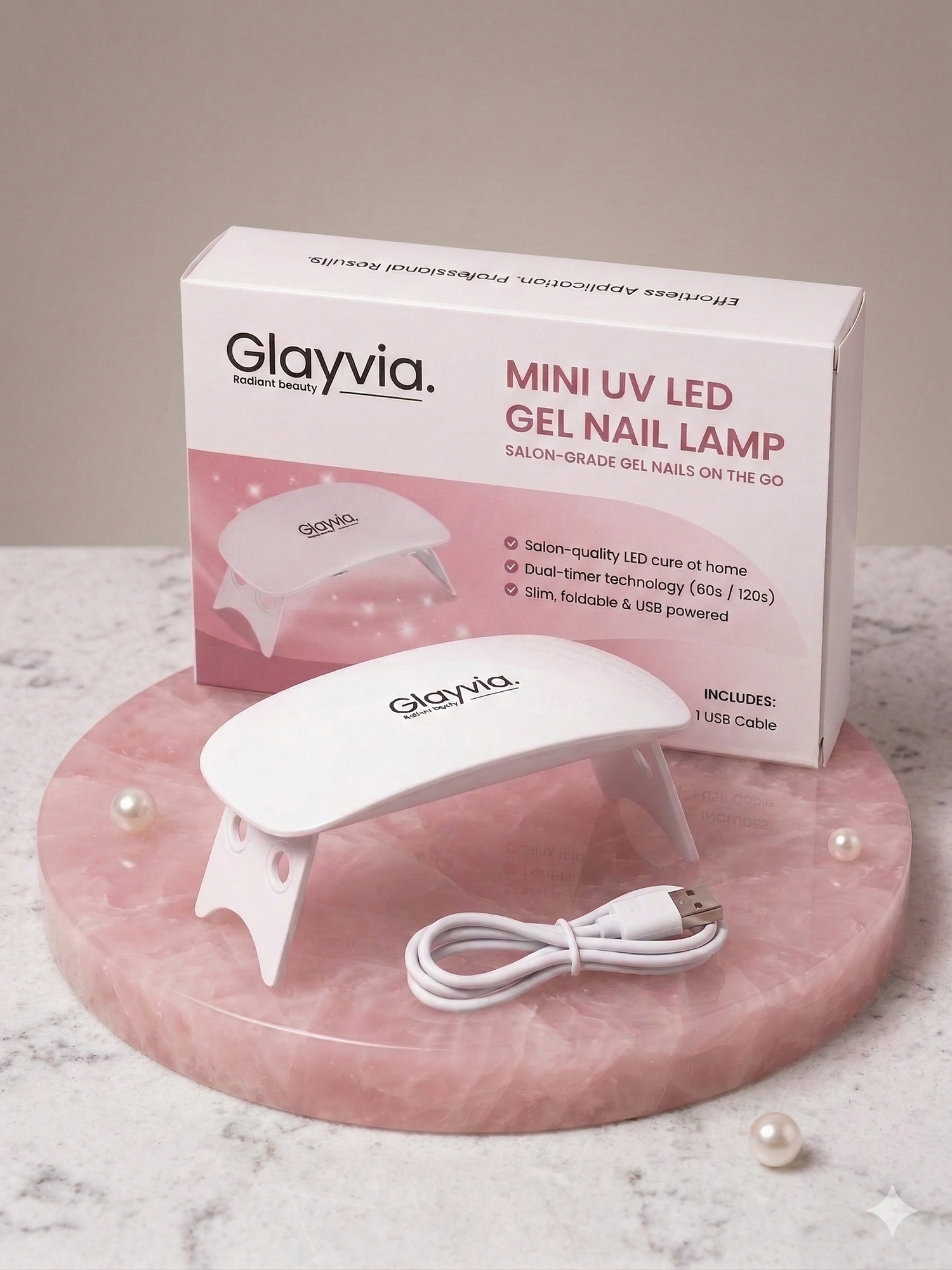 Glayvia Mini UV LED Gel Nail Lamp with packaging box and USB Cable displayed on marble surface showing portable salon grade LED nail curing lamp