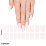 Hand wearing Glayvia NG200001 milky nude gloss semi cured gel nail wraps displayed above matching soft nude nail wrap sticker sheet