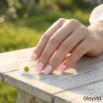 Lifestyle image of Glayvia NG200032 soft daisy blush semi cured gel nail wraps with floral manicure beside daisy flower on wooden surface