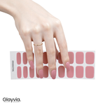 Hand wearing Glayvia NG200060 dusty rose gloss semi cured gel nail wraps displayed above matching muted pink nail wrap sticker sheet
