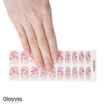 Hand wearing Glayvia NG200076 confetti semi cured gel nail wraps displayed above matching colourful confetti nail wrap sticker sheet