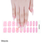 Hand wearing Glayvia NG200092 peach iridescent glitter semi cured gel nail wraps displayed above matching peach glitter nail wrap sticker sheet