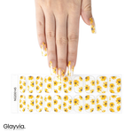 Hand wearing Glayvia NG200145 sunflower semi cured gel nail wraps displayed above matching sunflower nail wrap sticker sheet