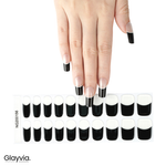 Hand wearing Glayvia NG200156 black french tip semi cured gel nail wraps displayed above matching black tip nail wrap sticker sheet