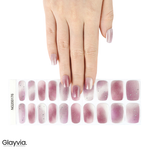 Hand wearing Glayvia NG200176 rose glitter ombre semi cured gel nail wraps displayed above matching pink glitter gradient nail wrap sticker sheet