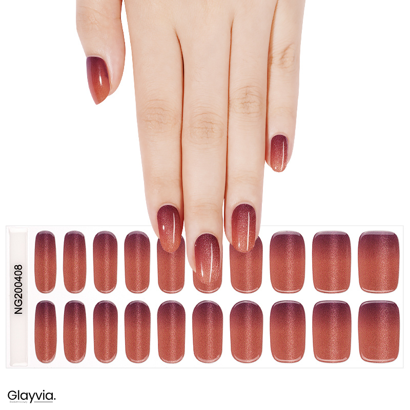 Hand wearing Glayvia NG200408 copper ombre shimmer semi cured gel nail wraps displayed above matching copper gradient nail wrap sticker sheet