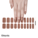 Hand wearing Glayvia nude brown semi-cured gel nail wraps displayed with matching nail wrap sheet (NG200235)