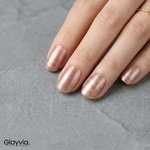 Close-up manicure showing Glayvia rose champagne semi-cured gel nail wraps with metallic finish applied on natural nails (NG200228)